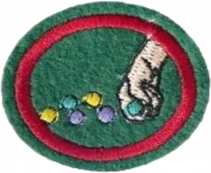 Insignia de la especialidad Canicas